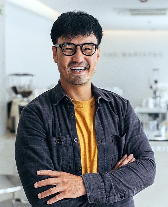 man smiling wearing glasses